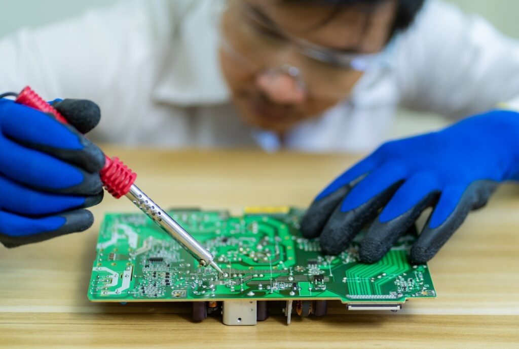 A Worker Showing What is Solder Mask in PCB